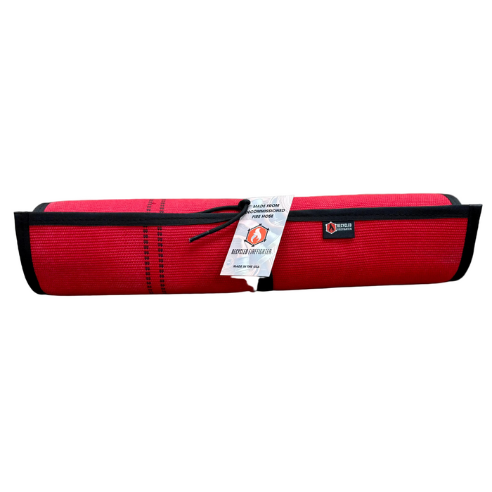 Drop Zone Mat Regular in use — flexible fire hose work surface for cleaning, organizing, or protecting work areas.