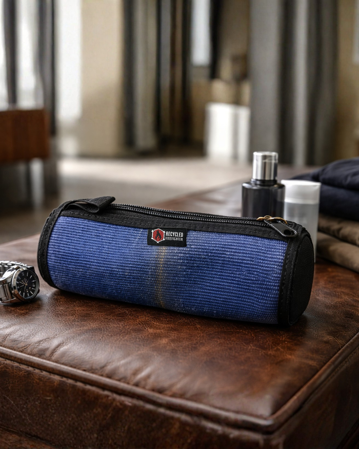 The Fire Hose Dopp Kit in blue by Recycled Firefighter. Tactical design meets professional durability standards.